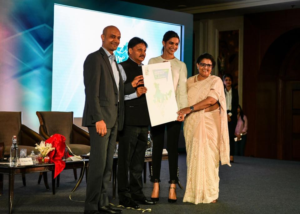 Indian Bollywood actress Deepika Padukone (2nd R), founder of the Live Love Laugh Foundation, is joined by foundation trustee Shyam Bhat (L), trustee board chair Anna Chandy (R), and Indian Department of Health and Family Welfare additional secretary Sanjeeva Kumar (2nd L) attend the unveiling event for a report on the public perception towards mental health in India, in New Delhi on March 23, 2018.  Bollywood star Deepika Padukone called March 23 for bolder efforts by Indians to end the stigma surrounding people suffering from mental illness. "We have a long way to go," said the Bollywood A-lister who went public about her struggle with depression in 2015, prompting praise for her campaign to spark public discourse on mental health in a country that has traditionally considered such illnesses taboo.  (Photo by CHANDAN KHANNA/AFP/Getty Images)