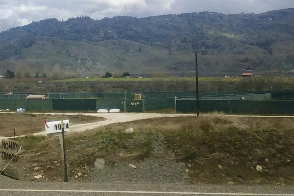 A complex of licensed marijuana grows north of Brewster, in north-central Washington state, is seen on Friday, April 7, 2023. Cannabis regulators have halted operations at several outdoor pot farms and processing facilities located on a stretch of former fruit orchards in north-central Washington state after testing found high levels of chemicals related to a dangerous pesticide used decades ago. The sweeping action announced Thursday night, April 6, 2023, by the Liquor and Cannabis Board renewed concerns about pesticides in marijuana, and put dozens of people at least temporarily out of work just as they were preparing for spring planting. (AP Photo)