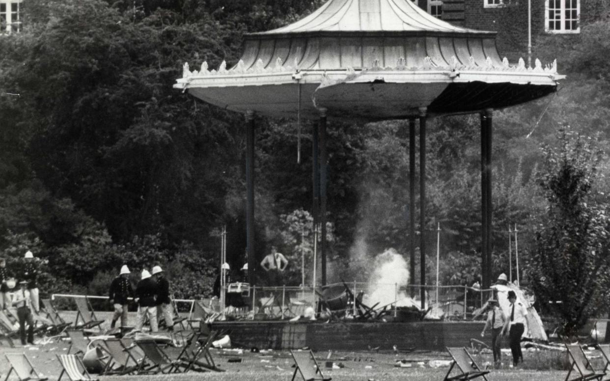 London IRA Bombing: Police and firemen at the still smouldering bandstand in Regent's Park following the bomb outrage known to have killed six people.The bomb exploded where the band of the Royal Green jackets was playing on 20 July 1982 - PA