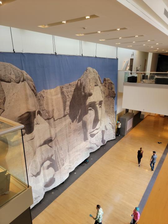 A backdrop of Mount Rushmore used in North by Northwest, on view at the Boca Raton Museum of Art. - Credit: Boca Raton Museum of Art