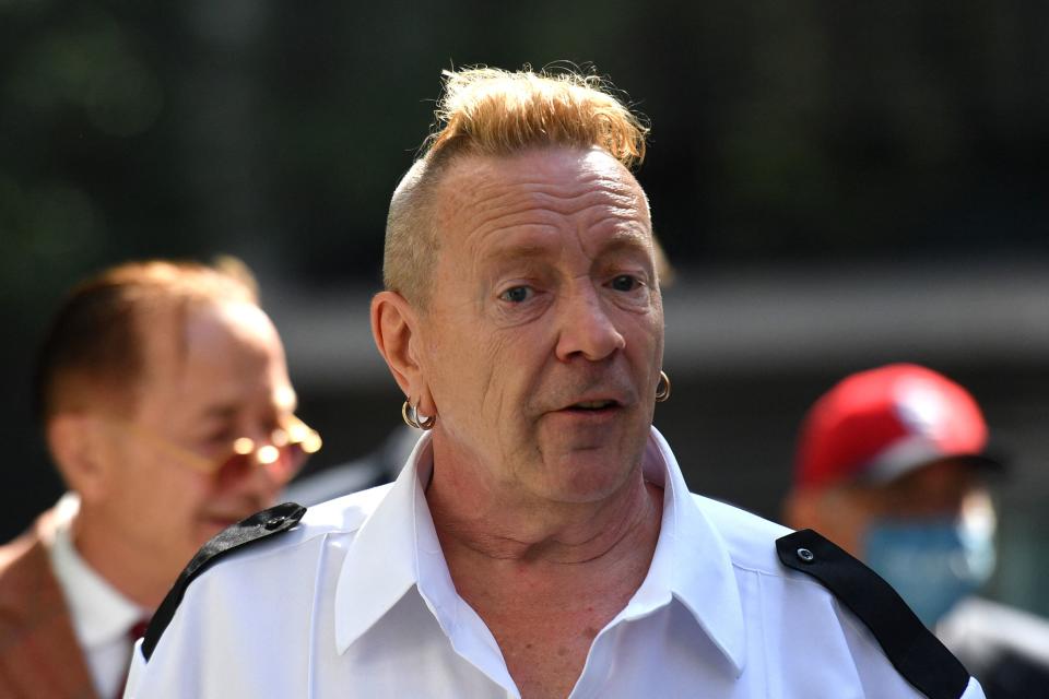 Sex Pistols frontman John Lydon, also known as Johnny Rotten arrives at the Rolls building in central London on July 22, 2021. - Lydon is in court to fight two former Sex Pistols band members over the use of their songs in an upcoming television series. (Photo by JUSTIN TALLIS / AFP) (Photo by JUSTIN TALLIS/AFP via Getty Images)