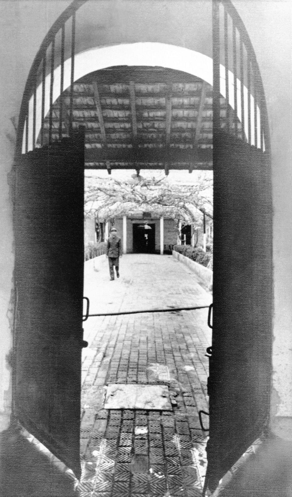 An iron door opens in 1973 on a compound of the "Hanoi Hilton" prison, used by North Vietnam to hold U.S. prisoners of war during the Vietnam War. U.S. Air Force veteran John Clark, a Columbia resident, was imprisoned at Hanoi for nearly six years before his and others' release in early 1973.