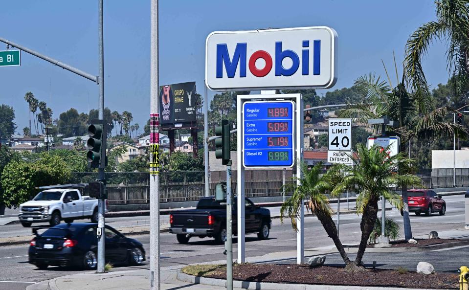 <p>FREDERIC J. BROWN / AFP via Getty Images</p> Vehicles pass an ExxonMobil gas station on September 23, 2024 in Rosemead, California.