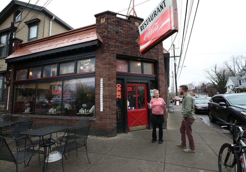 Tonya Johnson, left, a waitress at the Burger Boy diner stepped outside to confirm an order with customer Jarrod Dentith.Mar. 25, 2019