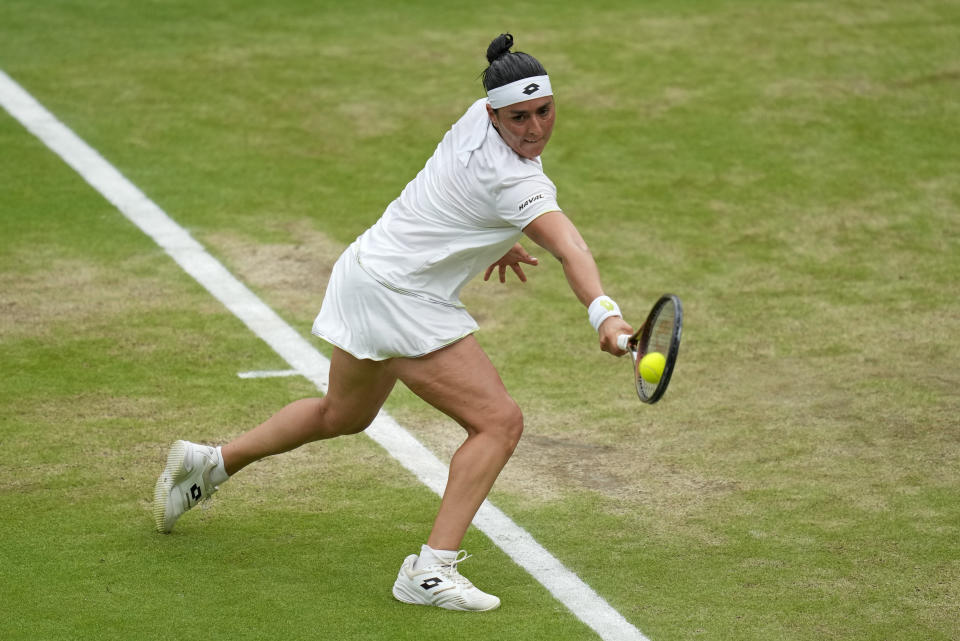 Tunisia's Ons Jabeur returns to Czech Republic's Marketa Vondrousova in the final of the women's singles on day thirteen of the Wimbledon tennis championships in London, Saturday, July 15, 2023. (AP Photo/Kirsty Wigglesworth)