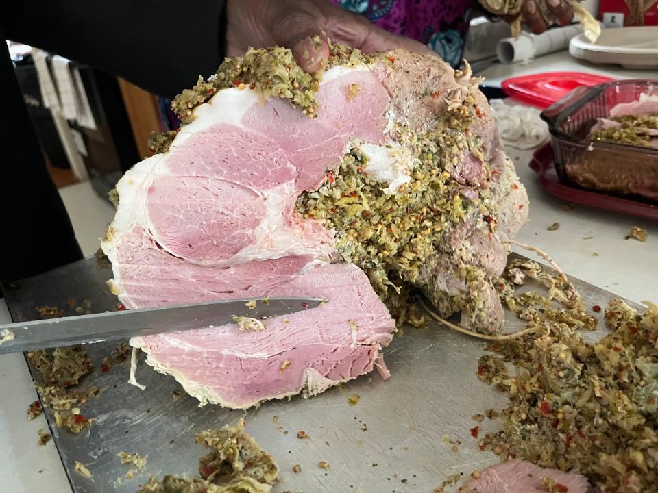 Maryland stuffed ham, a centuries-old tradition unique to St. Mary's County, MD, is served every major holiday with recipes passed down through generations. The dish, a corned ham stuffed with greens, red pepper and mustard seed, was invented by enslaved people in Maryland and is a mix of African and English traditions.