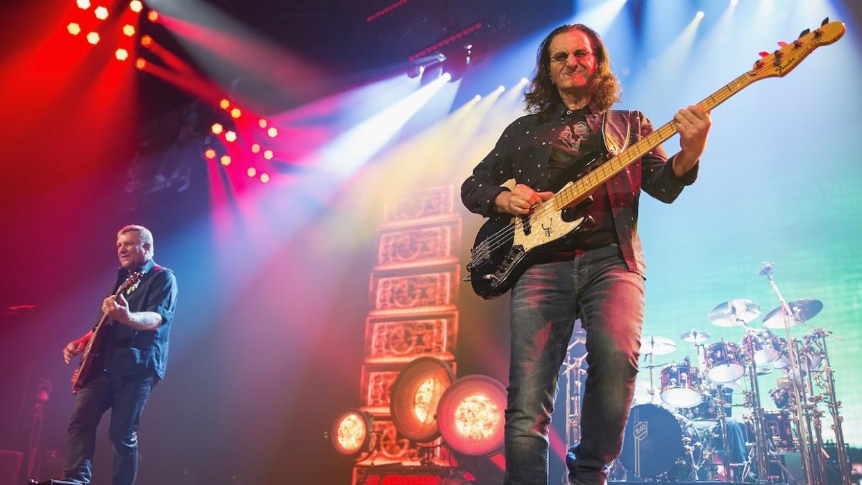  Alex Lifeson, Geddy Lee and Neil Peart of Rush performs on stage during the R40 LIVE Tour at KeyArena on July 19, 2015 in Seattle, Washington. . 