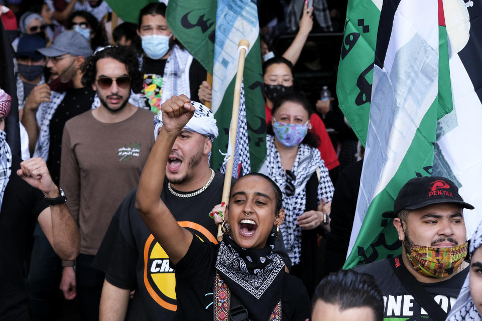 Demonstrators holding march to Israeli Consulate during a protest against Israel and in support of Palestinians, Saturday, May 15, 2021 in the Westwood section of Los Angeles. (AP Photo/Ringo H.W. Chiu)