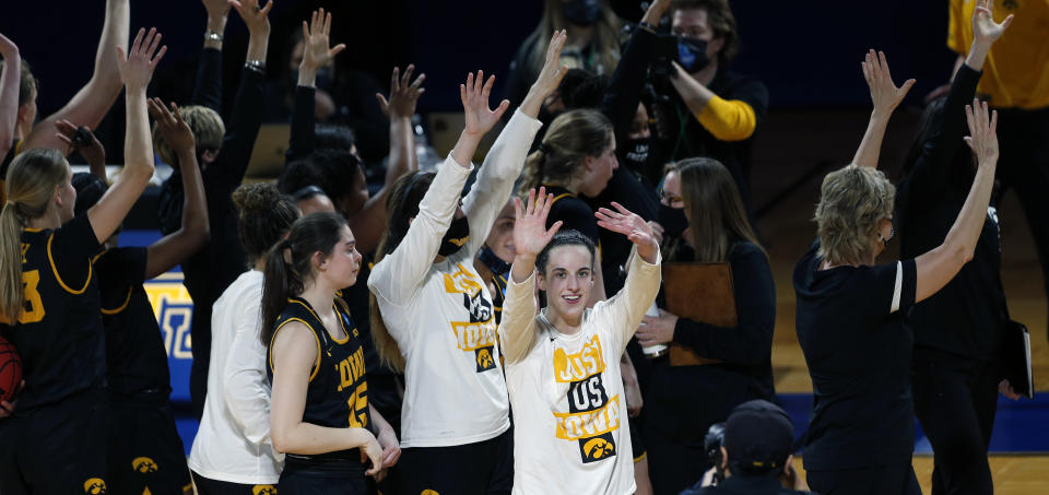 Iowa guard Caitlin Clark (22) and the rest of the team acknowledge the fans at the end a college basketball game against Kentucky in the second round of the women's NCAA tournament at the Greehey Arena in San Antonio, Tuesday, March 23, 2021. Iowa defeated Kentucky 86-72. (AP Photo/Ronald Cortes)