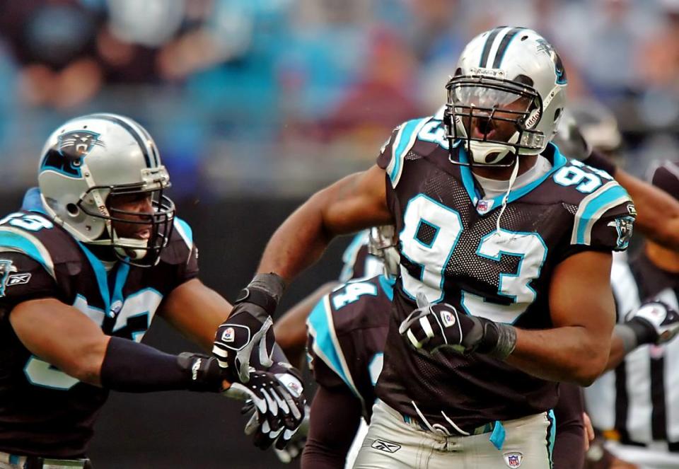 Carolina defensive end Mike Rucker (93) celebrates his sack of Atlanta quarterback Michael Vick in Carolina’s 24-6 win on Dec. 4, 2005, in Charlotte.