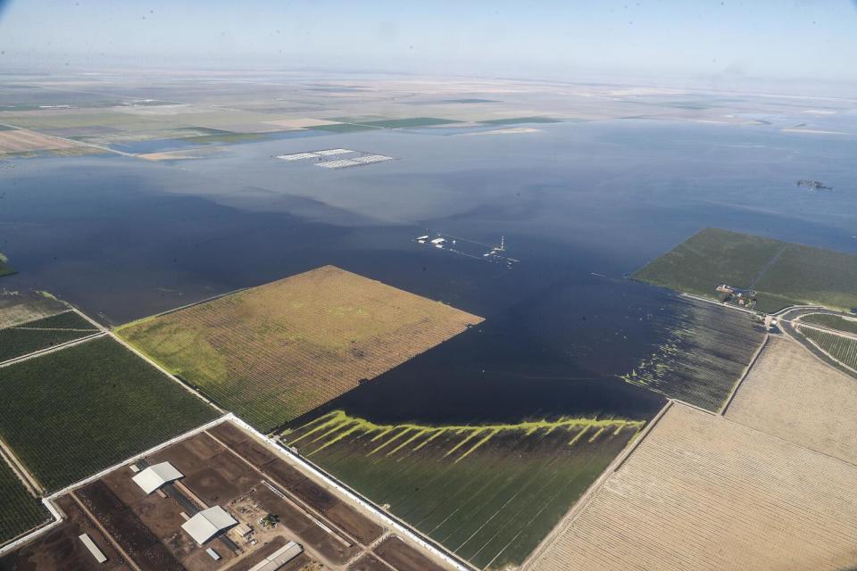 Flooded farmland is seen from above.