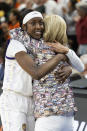 LSU's Flau'jae Johnson, left, hugs head coach Kim Mulkey moments before defeating Miami in an Elite 8 college basketball game to earn a trip to the Final 4 of the NCAA Tournament in Greenville, S.C., Sunday, March 26, 2023. (AP Photo/Mic Smith)