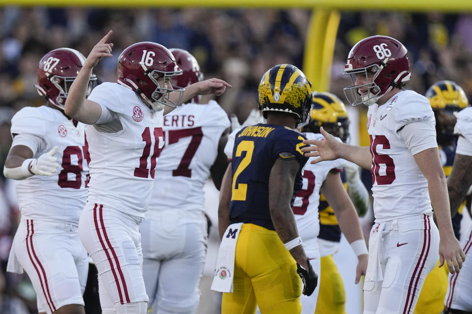 Alabama place kicker Will Reichard, left, celebrates his field goal with place holder James Burnip, right, during the first half in the Rose Bowl CFP NCAA semifinal college football game against Michigan, Monday, Jan. 1, 2024, in Pasadena, Calif. (AP Photo/Mark J. Terrill)