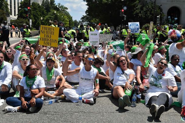 PHOTO: Abortion rights activists sit down near the US Capitol as they protest the US Supreme Court decision to overturn Roe Vs. Wade in Washington on June 30, 2022. (Nicholas Kamm/AFP via Getty Images)