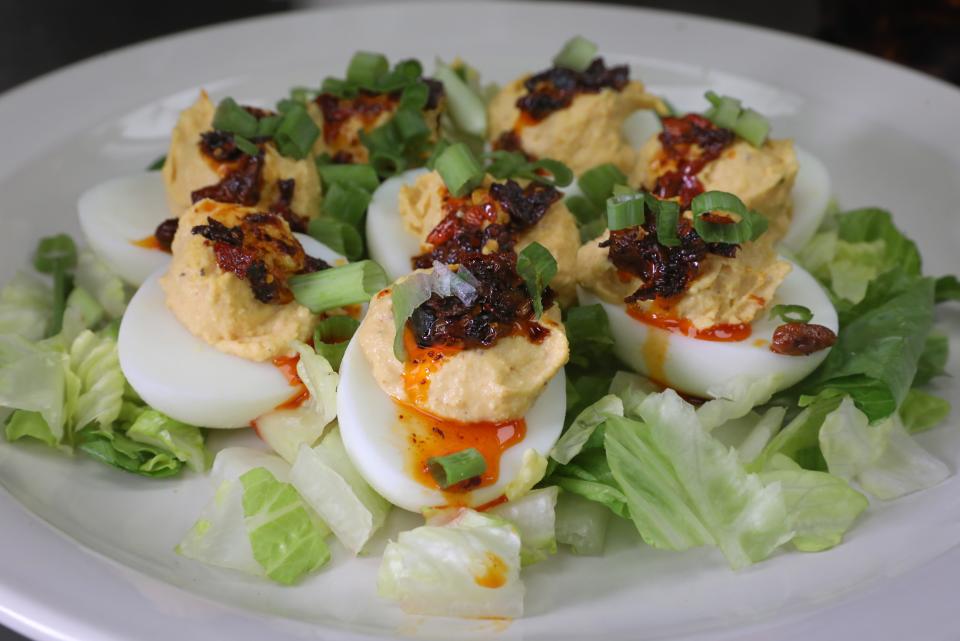 The Silo Brunch Bar's deviled eggs, topped with scallions and chili crisp, are meant to be shared.