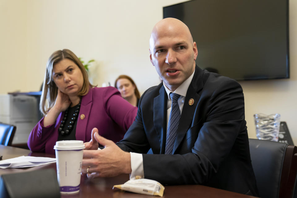 Rep. Elissa Slotkin, D-Mich., left, and Rep. Anthony Gonzalez, R-Ohio, part of a small group of freshman representatives calling themselves Task Force Sentry, gather for an interview with The Associated Press to discuss their focus on election security, on Capitol Hill in Washington, Thursday, June 27, 2019. (AP Photo/J. Scott Applewhite)