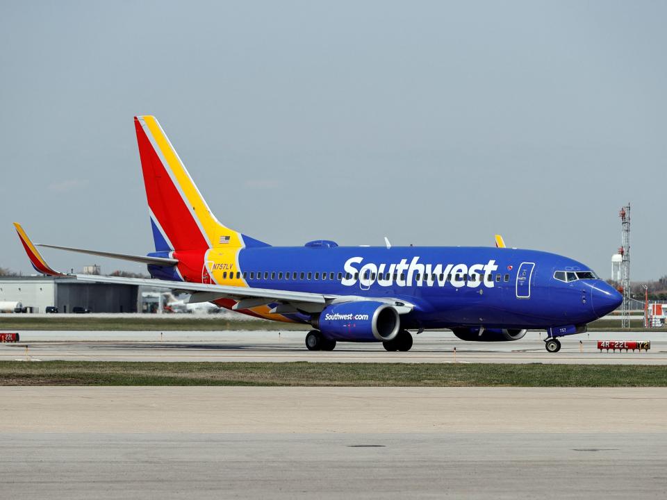 A Southwest Airlines Boeing 737-7H4 jet taxis to the gate