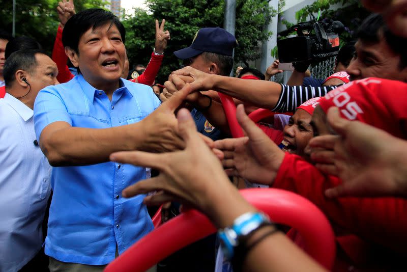 FILE PHOTO: Former senator Ferdinand "Bongbong" Marcos Jr and son of late former dictator Ferdinand Marcos is greeted by his supporters upon his arrival at the Supreme Court in metro Manila