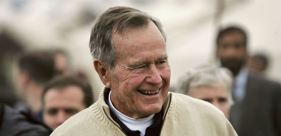 Former U.S. President George Bush visits a tent camp for earthquake survivors on the outskirts of Islamabad on January 17, 2006 in Pakistan.