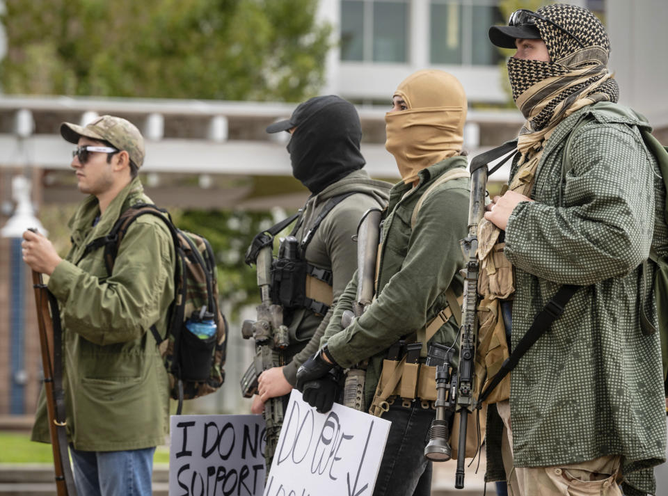 People display open carry firearms at a Second Amendment Protest in response to Gov. Michelle Lujan Grisham's recent public health order suspending the conceal and open carry of guns in and around Albuquerque for 30-days, Tuesday, Sept. 12, 2023, in Albuquerque, N.M. (AP Photo/Roberto E. Rosales)