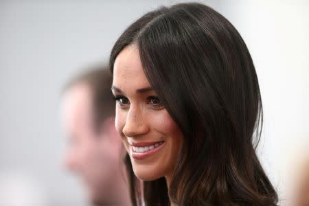 FILE PHOTO: Britain's Prince Harry's fiancee Meghan Markle attends a reception with delegates from the Commonwealth Youth Forum at the Queen Elizabeth II Conference Centre, London, April 18, 2018. Yui Mok/Pool via Reuters