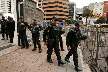 Police guard in front of the Electoral National Council (CNE) headquarters prior to Sunday presidential election in Quito, Ecuador, April 1, 2017. REUTERS/Mariana Bazo