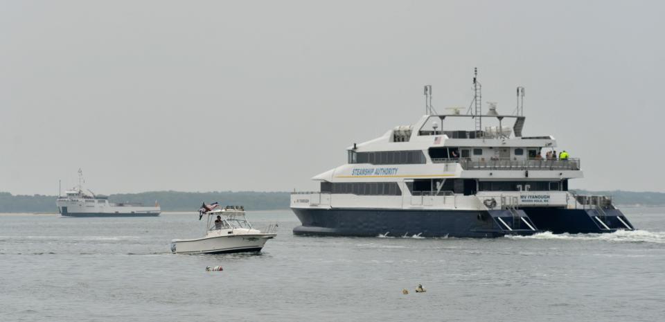 The Steamship Authority's fast ferry, the M/V Iyanough, right, heads out of the harbor for its 11 a.m. trip to Nantucket as its sister ferry, the M/V Sankaty, comes in. Steamship Authority ferries can be seen coming and going off Bay View Beach on Monday. The Authority has announced it will cutting service due to a shortage of workers.