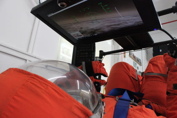 : Final Frontier Design's third-generation spacesuit in a flight simulator.