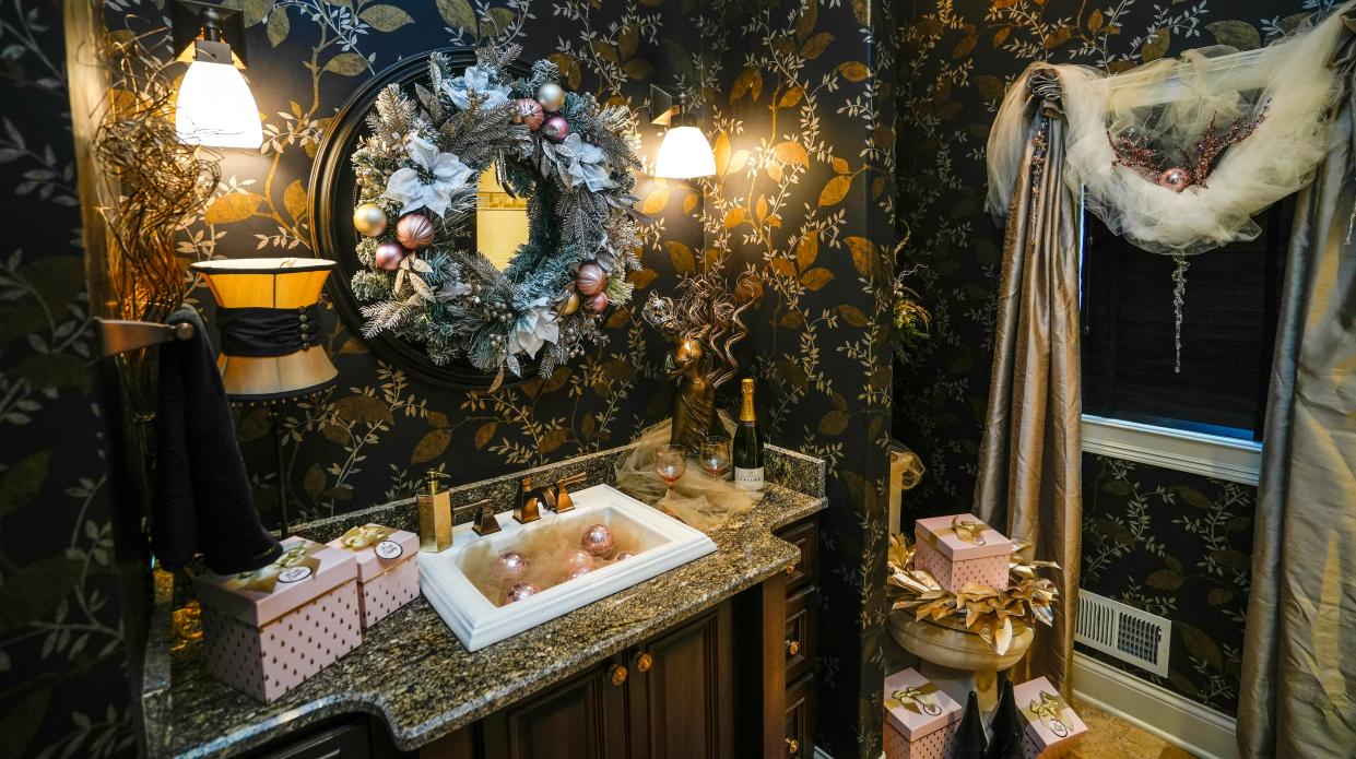Jackie Malinowski, decorator and owner of Key Pieces in Merton, decorated a first-floor bathroom in Alan and Laura Swan's house with the theme "Champagne and Roses." The home is decked out for the holidays as part of the 2023 Christmas Fantasy House, an annual fundraiser for the Ronald McDonald House Charities.