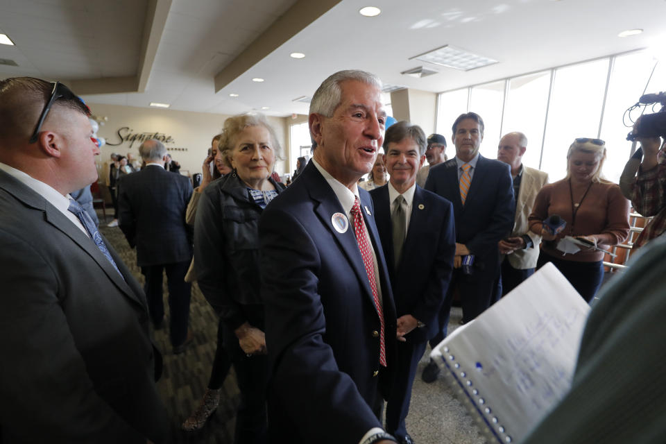 Louisiana's Republican gubernatorial candidate Eddie Rispone greets supporters and talks to media on a campaign stop at New Orleans International Airport in Kenner, La., Monday, Nov. 4, 2019. Rispone says a radio ad linking him and President Donald Trump to former Ku Klux Klan leader David Duke is "disgusting." Rispone is blaming Democratic incumbent John Bel Edwards for the advertising by the New Orleans-based Black Organization for Leadership Development. There's no evidence Edwards is connected to the effort. (AP Photo/Gerald Herbert)