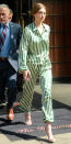 <p>Miss Hadid took to the streets in a pair of emerald green Morgan Lane silk pajamas (shop a similar style <a rel="nofollow noopener" href="https://www.shopbop.com/amanda-fatherazi-top-morgan-lane/vp/v=1/1502996449.htm?" target="_blank" data-ylk="slk:here;elm:context_link;itc:0;sec:content-canvas" class="link ">here</a>). The model paired her bedtime-inspired look with geek-chic glasses and strappy white sandals (shop a similar look <a rel="nofollow noopener" href="https://www.amazon.com/Stuart-Weitzman-Womens-Nudist-Sandal/dp/B00L22CUFS?" target="_blank" data-ylk="slk:here;elm:context_link;itc:0;sec:content-canvas" class="link ">here</a>). </p>