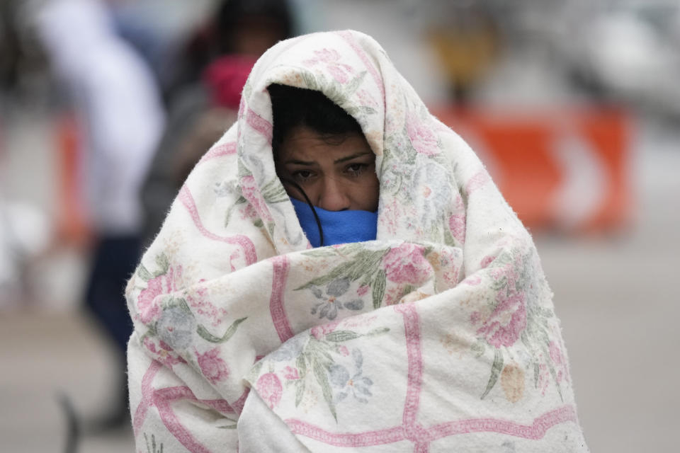 FILE - A migrant from Venezuela walks in the cold weather at a makeshift camp on the U.S.-Mexico border in Matamoros, Mexico, Dec. 23, 2022. The Biden administration on Thursday, Jan. 5, said it would immediately begin turning away Cubans, Haitians and Nicaraguans who cross the U.S.-Mexico border illegally, a major expansion of an existing effort to stop Venezuelans attempting to enter the U.S. (AP Photo/Fernando Llano, File)