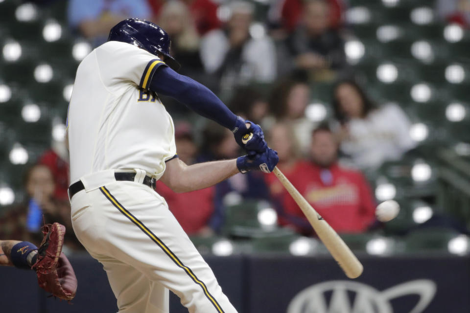 Milwaukee Brewers' Travis Shaw hits an RBI double during the sixth inning of the team's baseball game against the St. Louis Cardinals on Tuesday, May 11, 2021, in Milwaukee. (AP Photo/Aaron Gash)