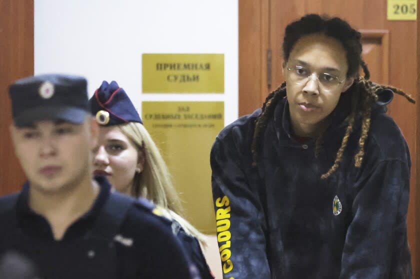 WNBA star and two-time Olympic gold medalist Brittney Griner is escorted to a courtroom for a hearing