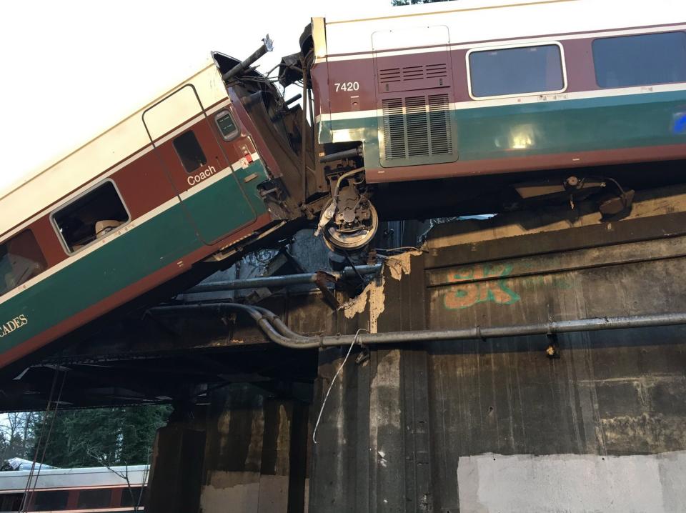 A handout photo made available by the Pierce County Sheriffs Department showing Amtrak train 501 which derailed onto Interstate 5 near Olympia, Washington — Shutterstock/AP