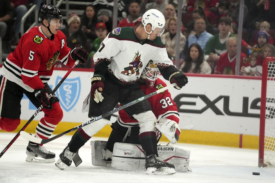 Arizona Coyotes center Nick Bjugstad (17) has his shot go wide during the first period of an NHL hockey game against the Chicago Blackhawks, Friday, Jan. 6, 2023, in Chicago. (AP Photo/Erin Hooley)