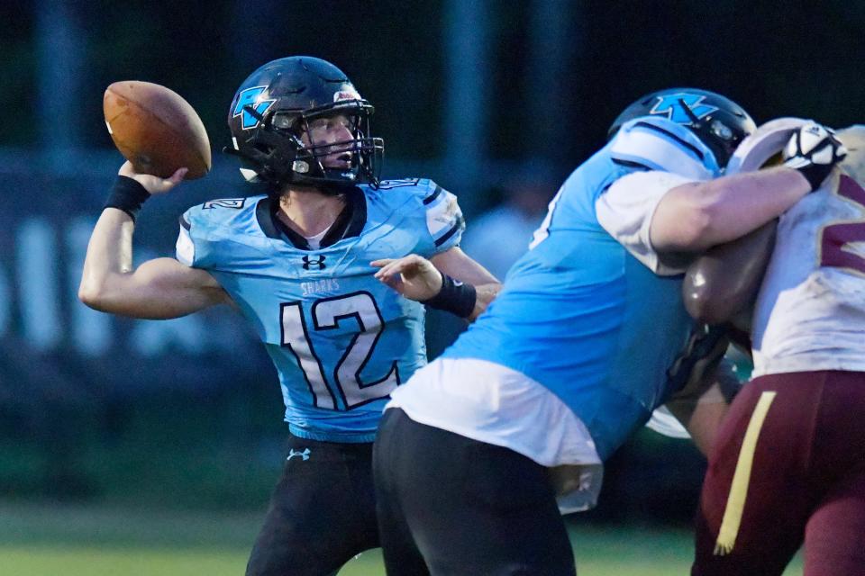 Ponte Vedra quarterback Ben Burk (12) targets receiver Wyatt Rogers on a pass play for a touchdown against Florida High.