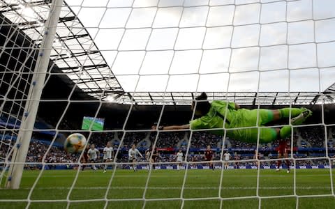 Argentina goalkeeper Vanina Correa saves a penalty by England's Nikita Parris - Credit: ap