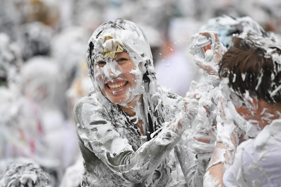 <p>Students from St Andrews University indulge in a tradition of covering themselves with foam to honor the “academic family” on Lower College Lawn on Oct. 23, 2017, in St Andrews, Scotland. (Photo: Jeff J Mitchell/Getty Images) </p>