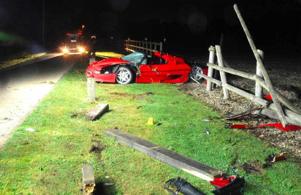 <em>The Ferrari F50 was pictured mangled and surrounded by broken fencing after the accident (PA)</em>