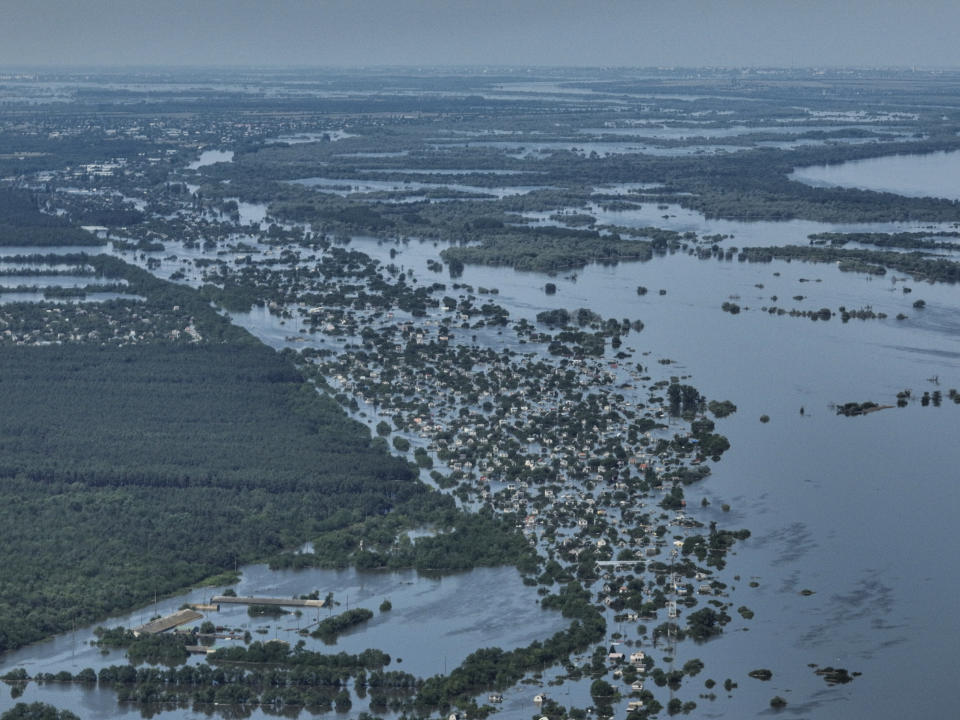 CAPTION CORRECTS LOCATION - Houses are seen under water in the flooded village of Korsunka, in Russian-occupied Ukraine, Wednesday, June 7, 2023. (AP Photo)