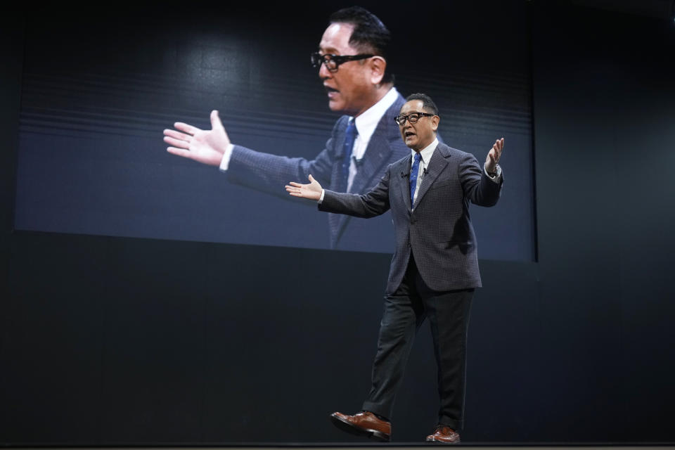 Toyota Motor Corp. Chief Executive Akio Toyoda delivers a speech on the stage at the Tokyo Auto Salon, an industry event similar to the world's auto shows Friday, Jan. 13, 2023, in Chiba near Tokyo. (AP Photo/Eugene Hoshiko)