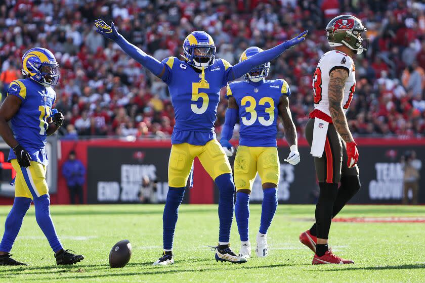 Rams cornerback Jalen Ramsey signals no catch as Tampa wide receiver Mike Evans walks away Jan. 23, 2022.