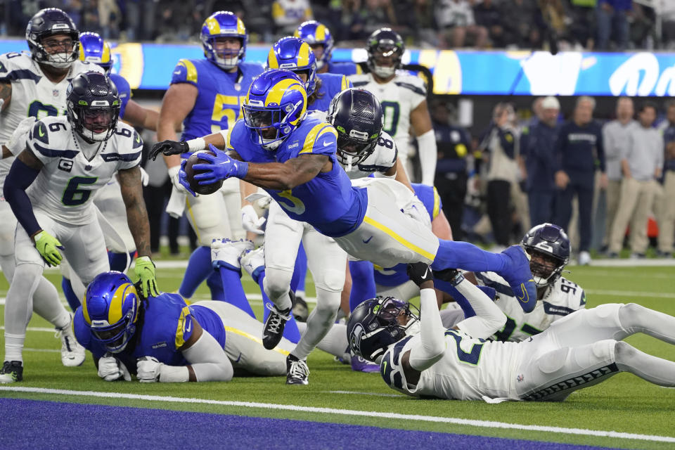 Los Angeles Rams running back Cam Akers dives into the end zone on a 6-yard touchdown run during the second half of an NFL football game against the Seattle Seahawks Sunday, Dec. 4, 2022, in Inglewood, Calif. (AP Photo/Mark J. Terrill)