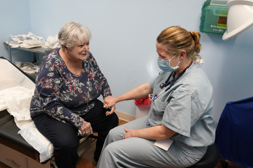 Dr. Catherine Casto, right, talks with Catherine Burns, left, of Millsboro, Del., during a visit to a Chesapeake Health Care office in Salisbury, Md., Thursday, March 2, 2023. Burns has been seeing Dr. Casto for 25 years. (AP Photo/Susan Walsh)