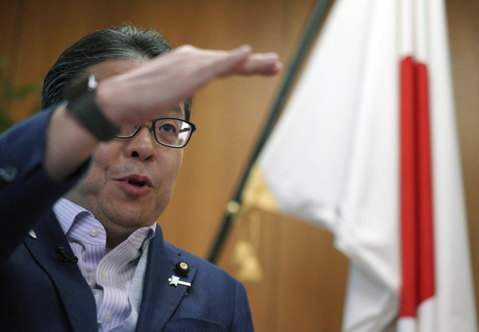 Japan’s Trade Minister Hiroshige Seko speaks during an exclusive interview with The Associated Press at his office in Tokyo Thursday, Aug. 23, 2018. Seko criticized President Donald Trump’s tariff policies as based on a serious misunderstanding about the importance of free trade and the contributions of Japanese companies to the U.S. economy. (AP Photo/Eugene Hoshiko)