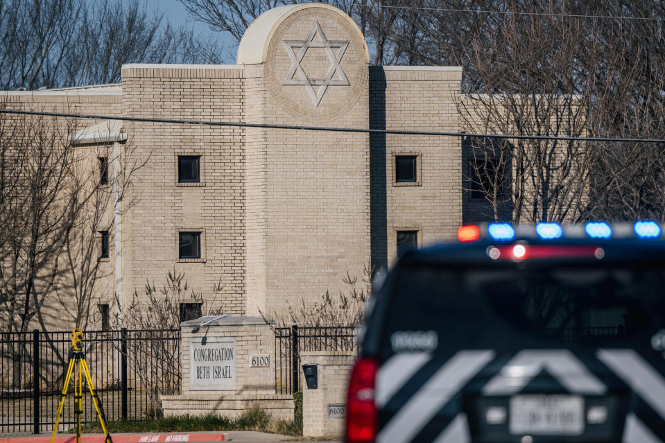 A law enforcement vehicle sits in front of the Congregation Beth Israel synagogue on January 16, 2022 in Colleyville, Texas, after the hostage standoff there ended safely. / Credit: / Getty Images