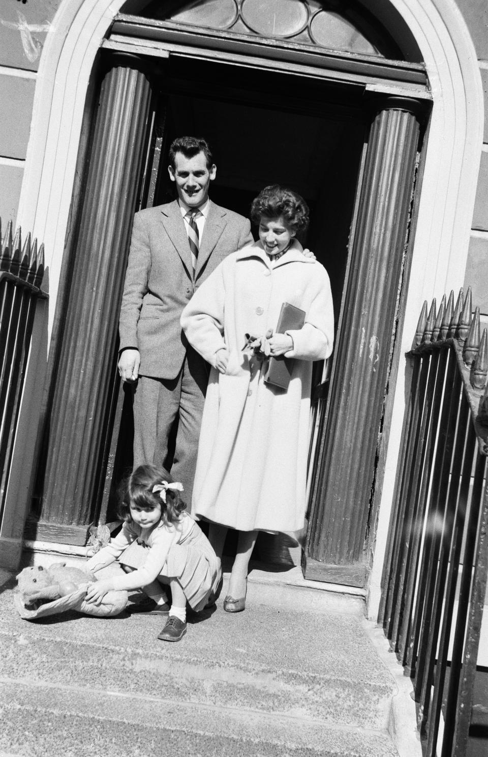 Albert and Rose Dimes with their young daughter in the entryway of their River Street home.