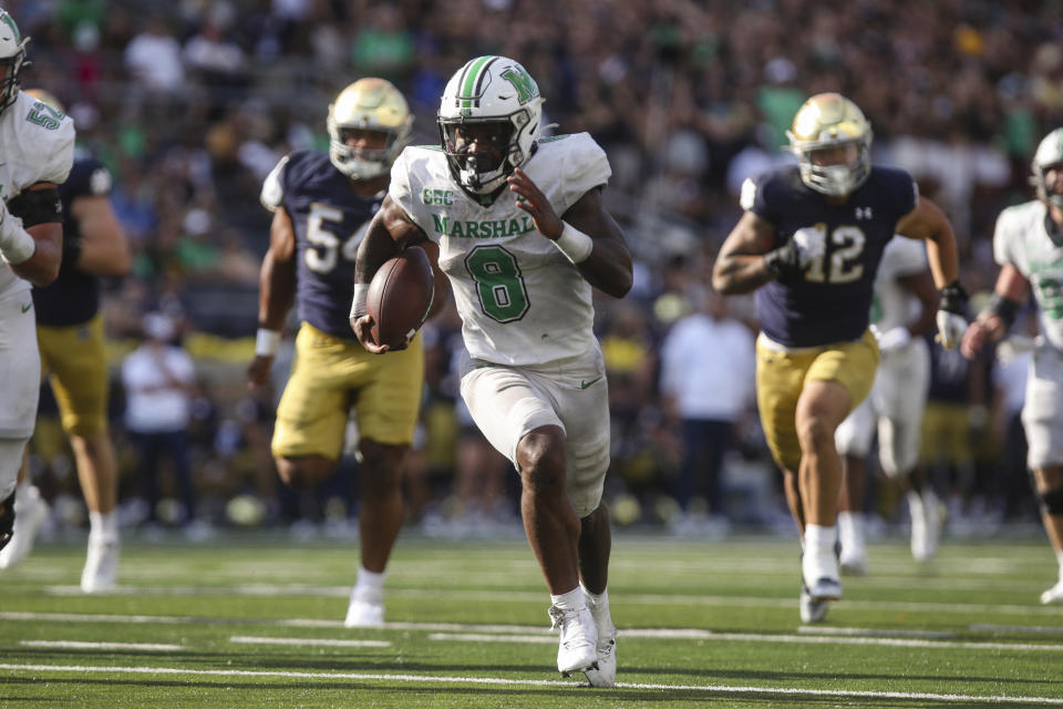 Marshall running back Khalan Laborn speeds up the field on a carry against Notre Dame during an NCAA college football game on Saturday, Sept. 10, 2022, at Notre Dame Stadium in South Bend, Ind. (Sholten Singer/The Herald-Dispatch via AP)