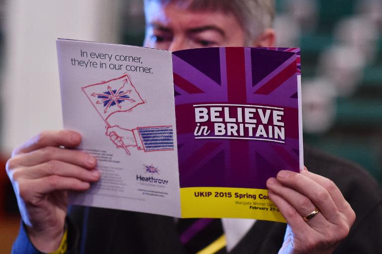 A delegate reads a programme on the first day of the UKIP spring conference in Margate, Kent, on February 27, 2015